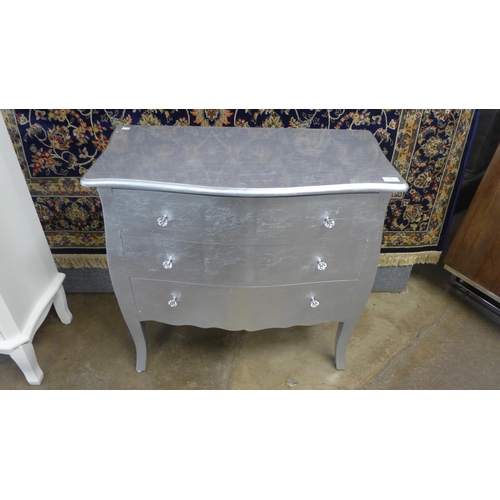 1488 - A silver three drawer bombe chest