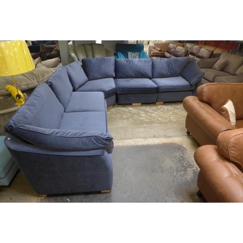 1506 - A midnight blue velvet curved corner sofa