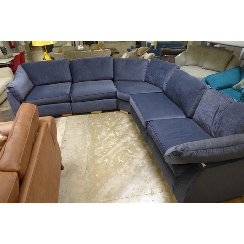 1506 - A midnight blue velvet curved corner sofa