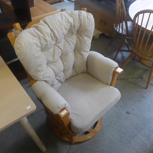 1666 - A Cosatto wooden and fabric rocker chair