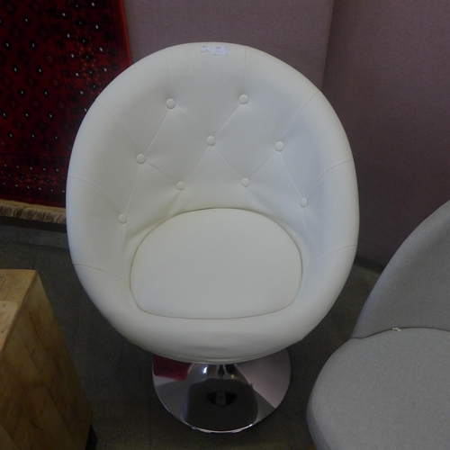 1693 - A cream button back swivel tub chair