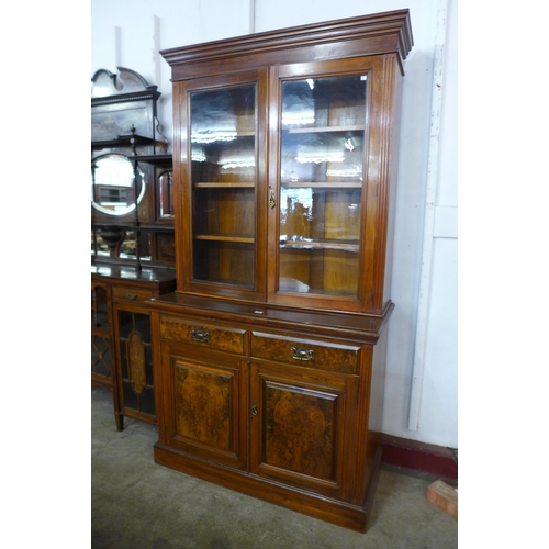 100 - A Victorian walnut and burr walnut bookcase