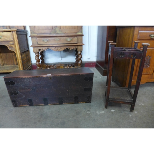 106 - An Arts and Crafts mahogany stick stand, a/f and an oak blanket box