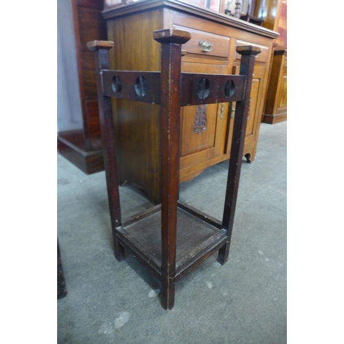 106 - An Arts and Crafts mahogany stick stand, a/f and an oak blanket box