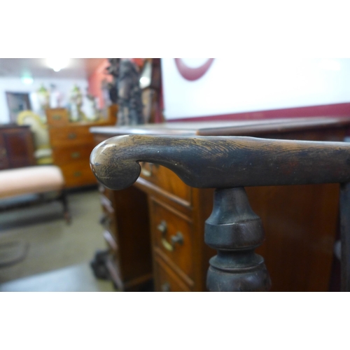 12 - A 19th Century elm and yew highback Windsor chair, attributed to Gabbitas workshop, Worksop, a/f