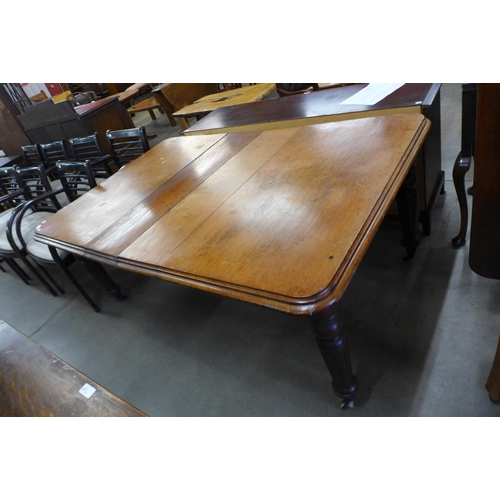 125 - A Victorian mahogany extending dining table