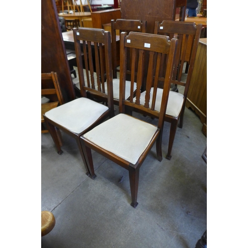 127 - A set of four Arts and Crafts beech dining chairs