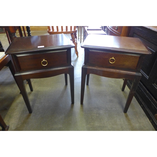 134 - A pair of Stag Minstrel mahogany bedside tables