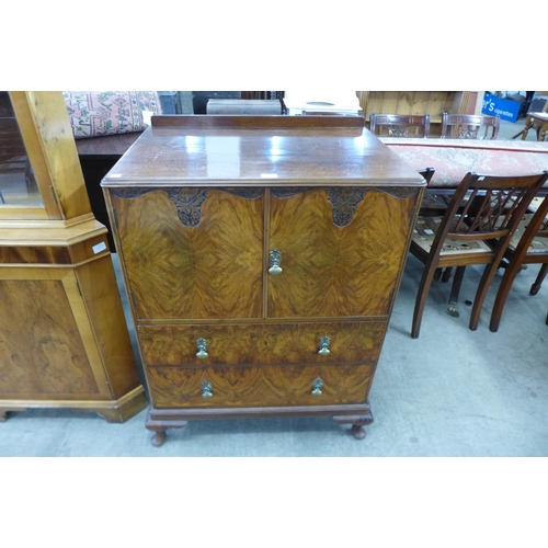 139 - An Art Deco figured walnut tallboy