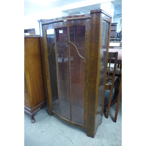 140 - An Art Deco oak display cabinet