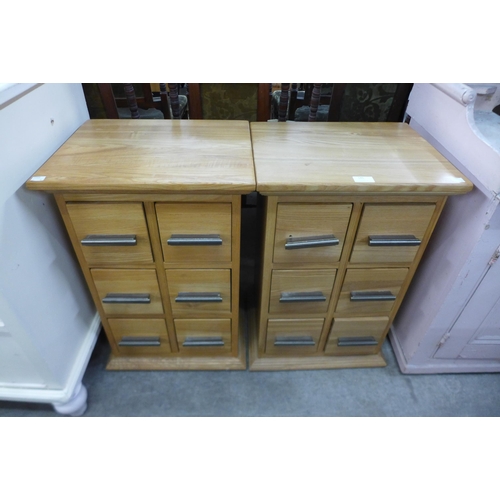 145 - A pair of small light ash chests of drawers