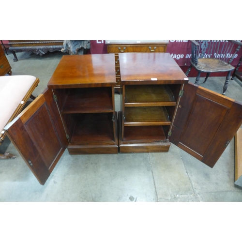 15 - A pair of Victorian mahogany single door pedestal cupboards