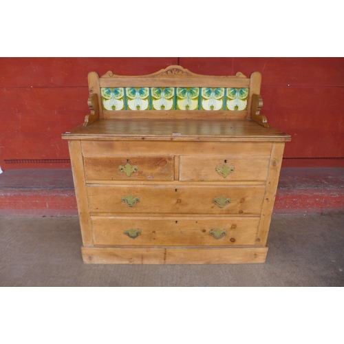 153b - An Arts and Crafts pine and tiled back washstand