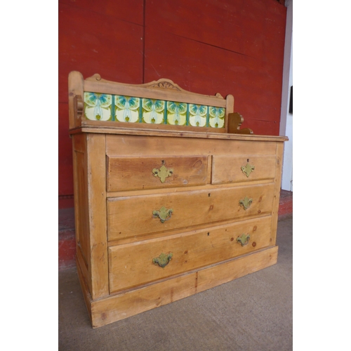 153b - An Arts and Crafts pine and tiled back washstand