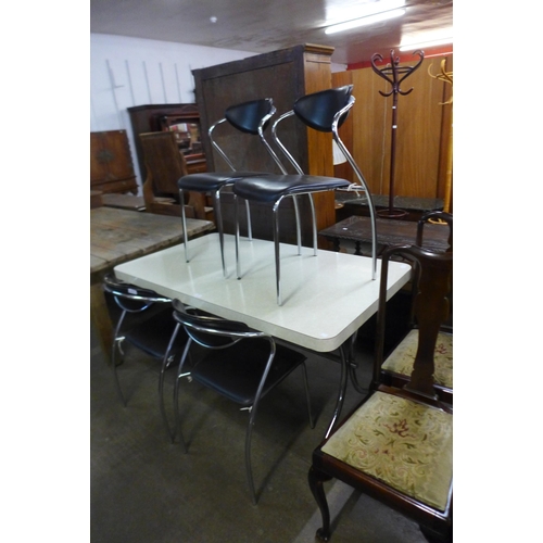 156 - A chrome and Formica topped kitchen table and four chairs