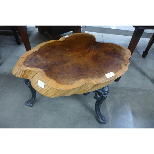 167 - A root wood and cast iron based coffee table