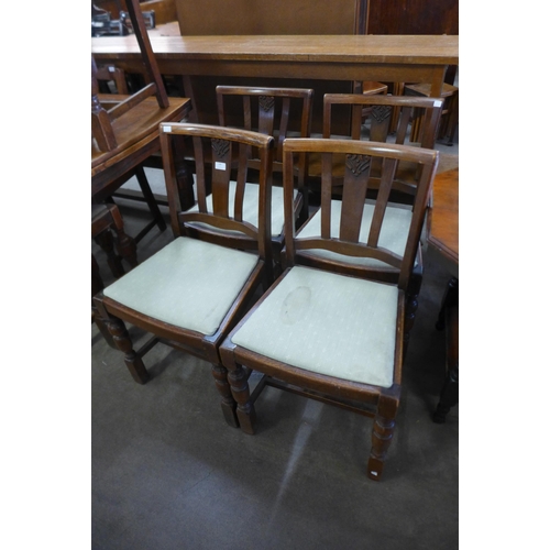 169 - A set of four oak dining chairs