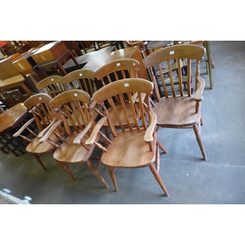 171 - A set of seven beech elbow chairs