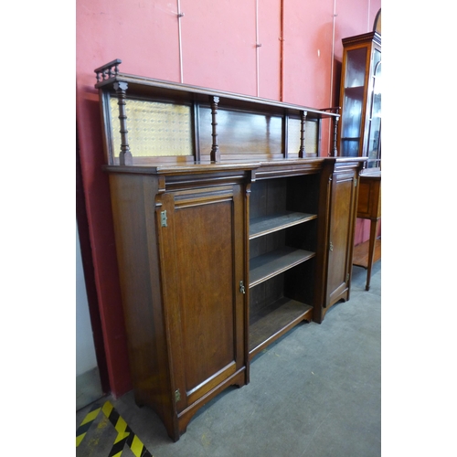 27 - A Victorian Aesthetic Movement walnut breakfront bookcase