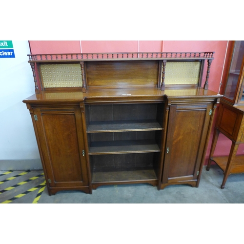 27 - A Victorian Aesthetic Movement walnut breakfront bookcase