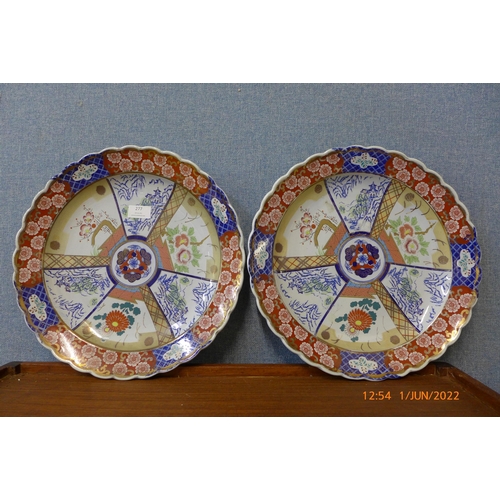 277 - A pair of Japanese Imari pattern porcelain chargers