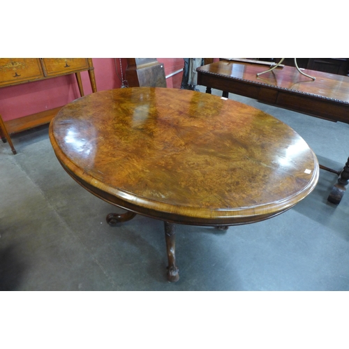 28 - A Victorian figured walnut oval tilt-top breakfast table