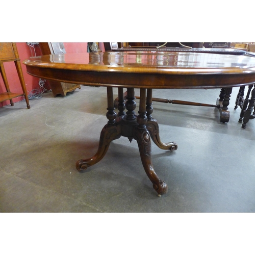 28 - A Victorian figured walnut oval tilt-top breakfast table