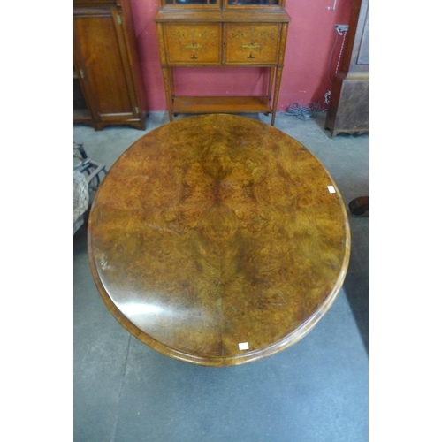 28 - A Victorian figured walnut oval tilt-top breakfast table