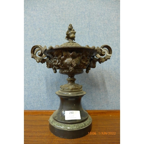 290 - A continental metal two handled urn and cover