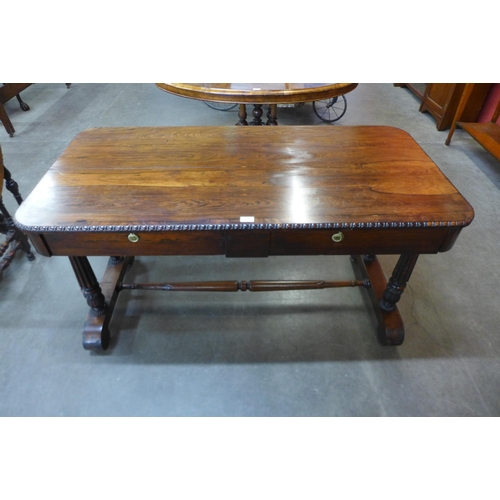 30 - An early Victorian rosewood two drawer stretcher table