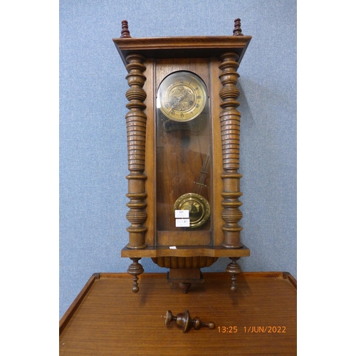 309 - A 19th Century walnut Vienna wall clock