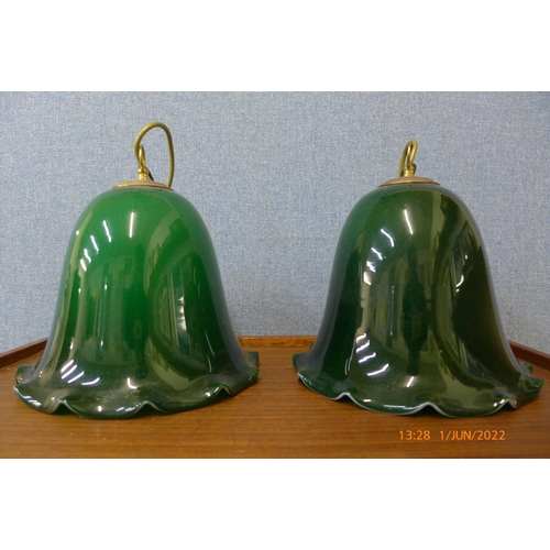 311 - A pair of Art Deco green glass hanging light shades