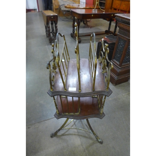 32 - A Victorian mahogany and brass revolving Canterbury/bookcase