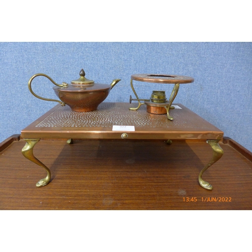 322 - A copper plate on brass feet with burner and a small W.A.S. Benson copper and brass teapot