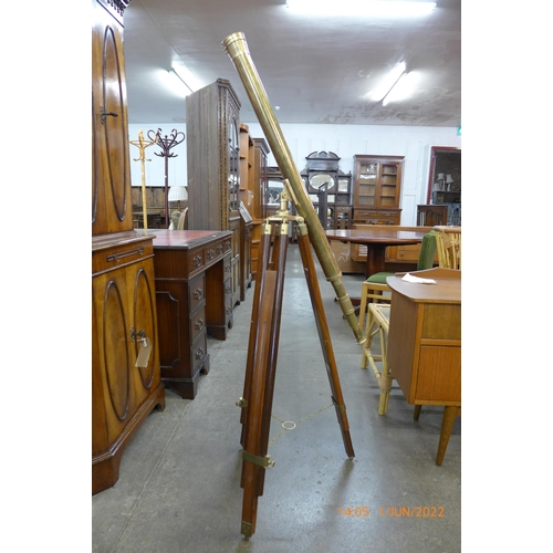 326 - A brass telescope on tripod stand