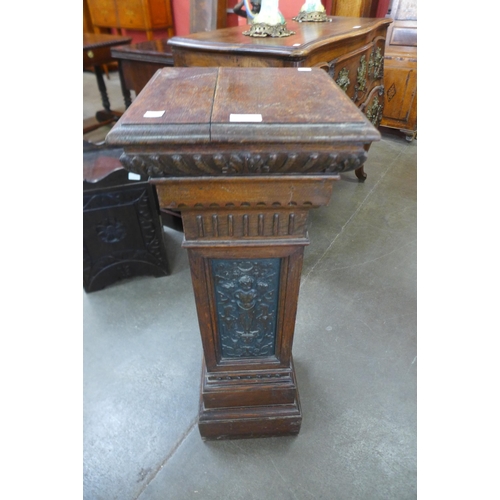 35 - A Victorian carved oak pedestal