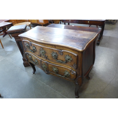 36 - An 18th Century style French provincial fruitwood bombe shaped commode