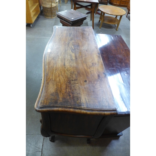 36 - An 18th Century style French provincial fruitwood bombe shaped commode