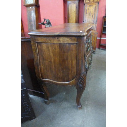 36 - An 18th Century style French provincial fruitwood bombe shaped commode