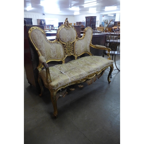 38 - A French Louis XV style giltwood canape settee