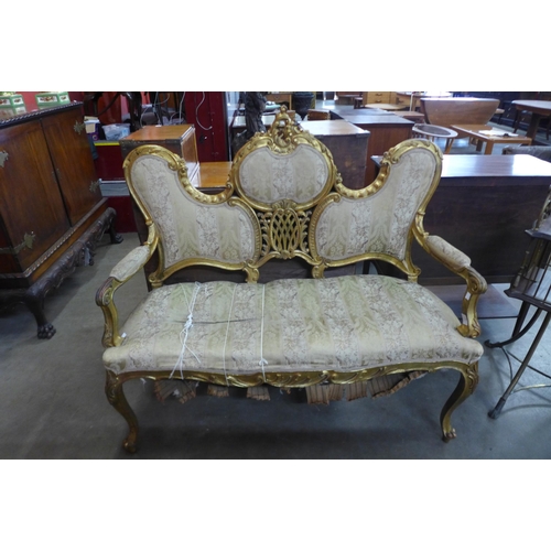 38 - A French Louis XV style giltwood canape settee