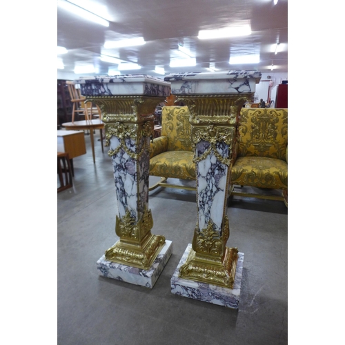 40 - A pair of French Louis XV style marble and gilt metal mounted pedestals