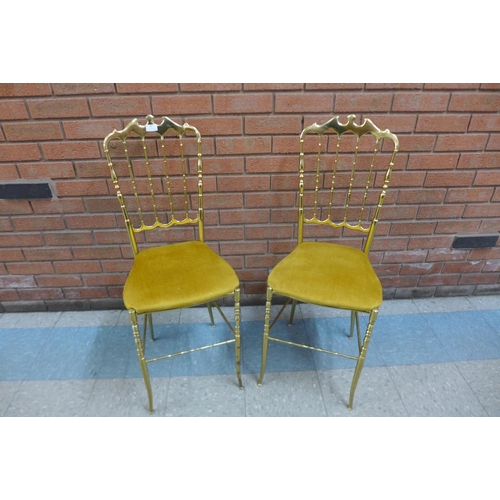 42 - A pair of Italian brass opera chairs