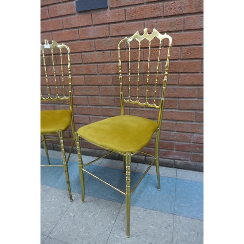 42 - A pair of Italian brass opera chairs