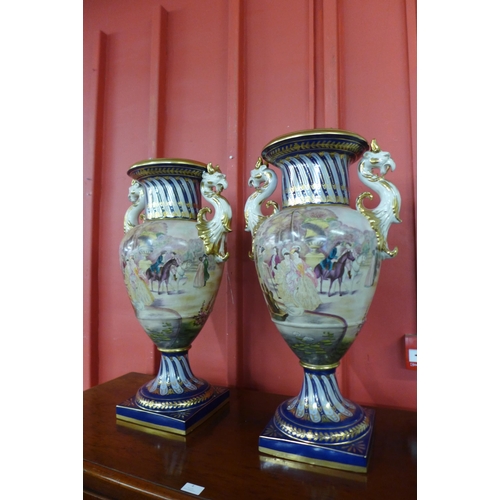 6 - A pair of large Italian style cobalt blue and gilt porcelain vases, decorated with Venetian scenes