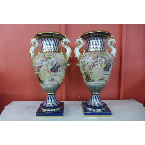 6 - A pair of large Italian style cobalt blue and gilt porcelain vases, decorated with Venetian scenes