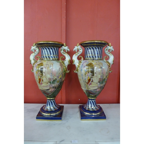 6 - A pair of large Italian style cobalt blue and gilt porcelain vases, decorated with Venetian scenes