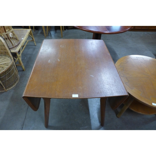 66 - A teak drop-leaf table