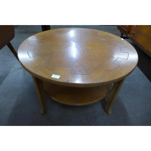 67 - A circular light oak coffee table