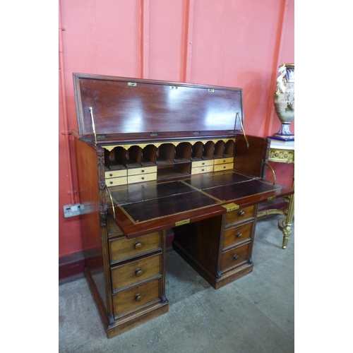 7 - A Victorian mahogany secretaire kneehole desk